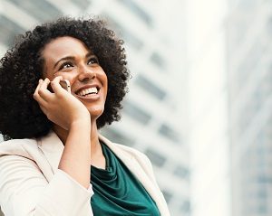 Woman making a phone call and smiling